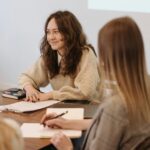 Creative professionals in a team meeting discussing strategies and planning for projects.